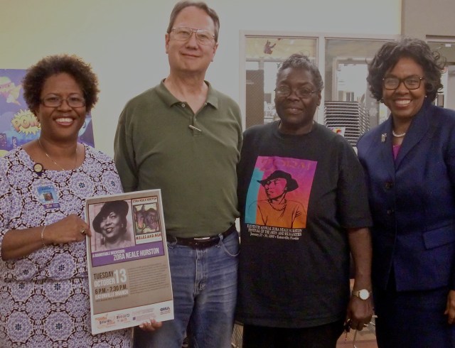 Branch Manager Patrice Florence-Walker (left) welcomed Hurston lovers to the Eatonville library at Zora Neale Hurston Square. All program participants received copies of Hurston's 